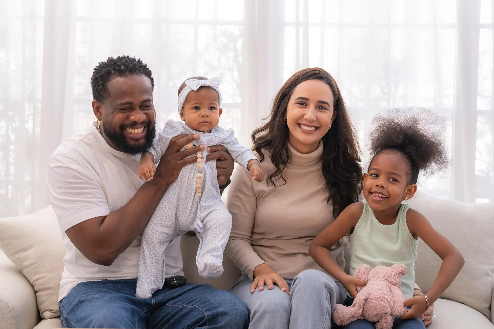 happy-mixed-race-family-sitting-on-the-living-room-2025-06-21-22-09-01-utc copy